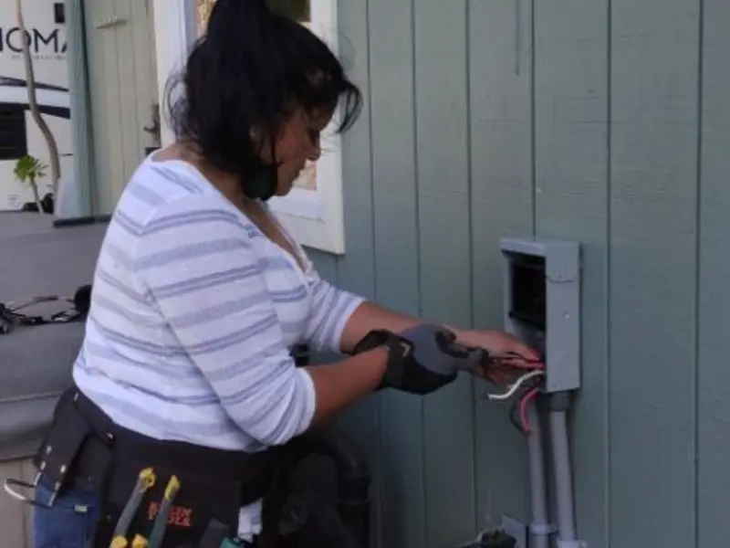 Licensed electrician wiring an exterior subpanel in Spokane Valley